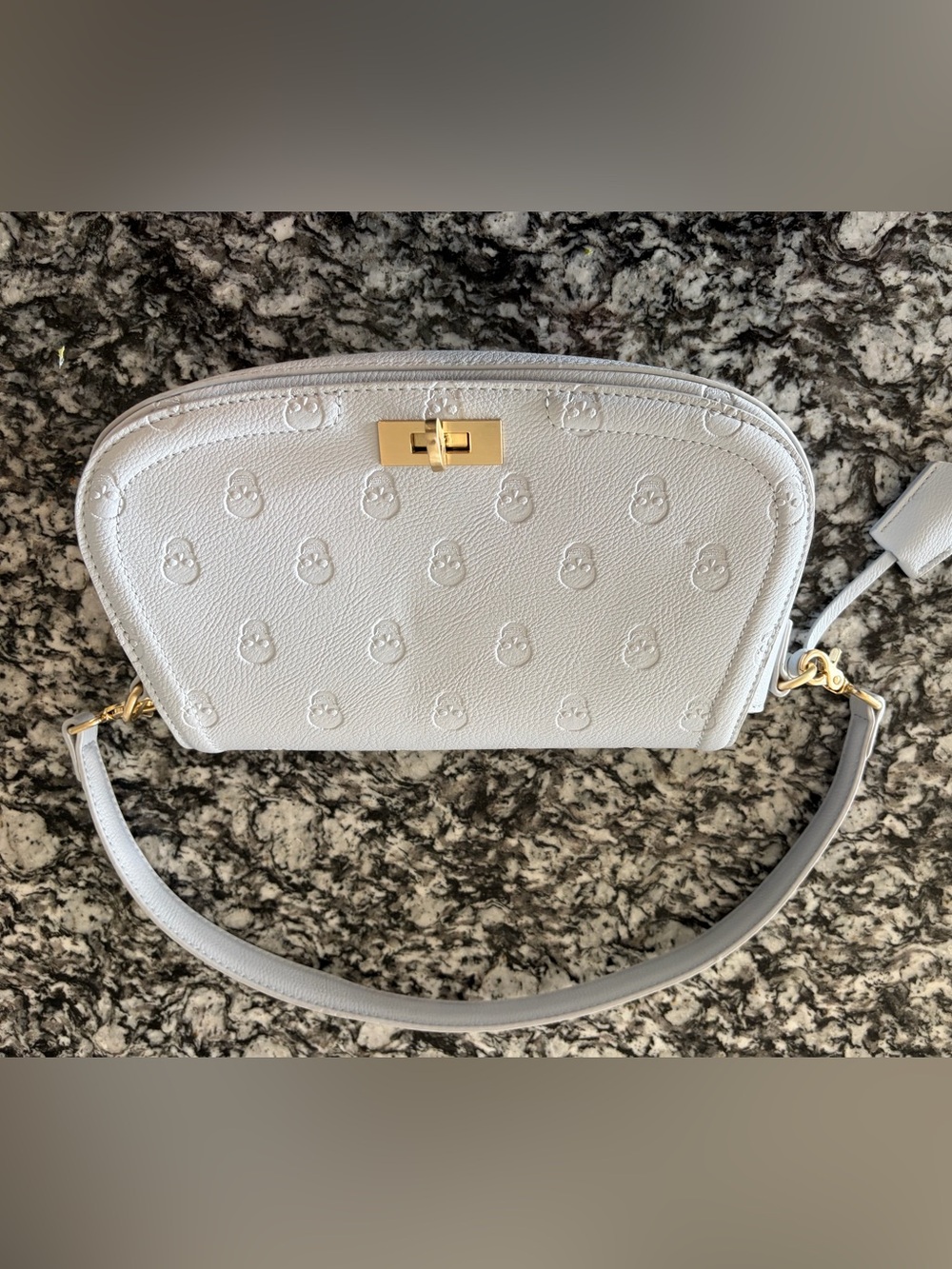 Betsey Johnson skull purse with gold colored hardware and keys light blue